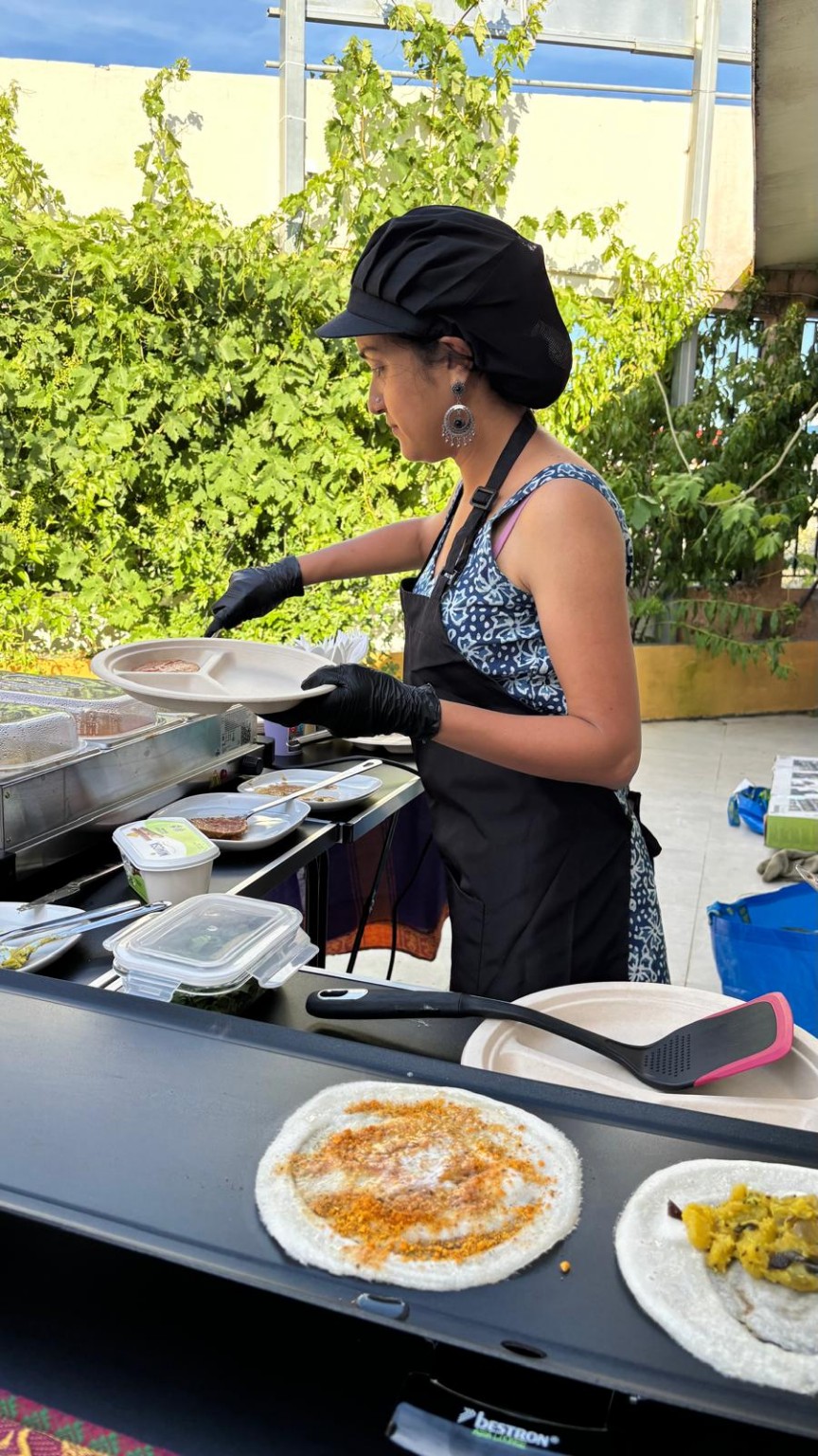 Anitha serving homemade sides beside podi and potato masala dosas